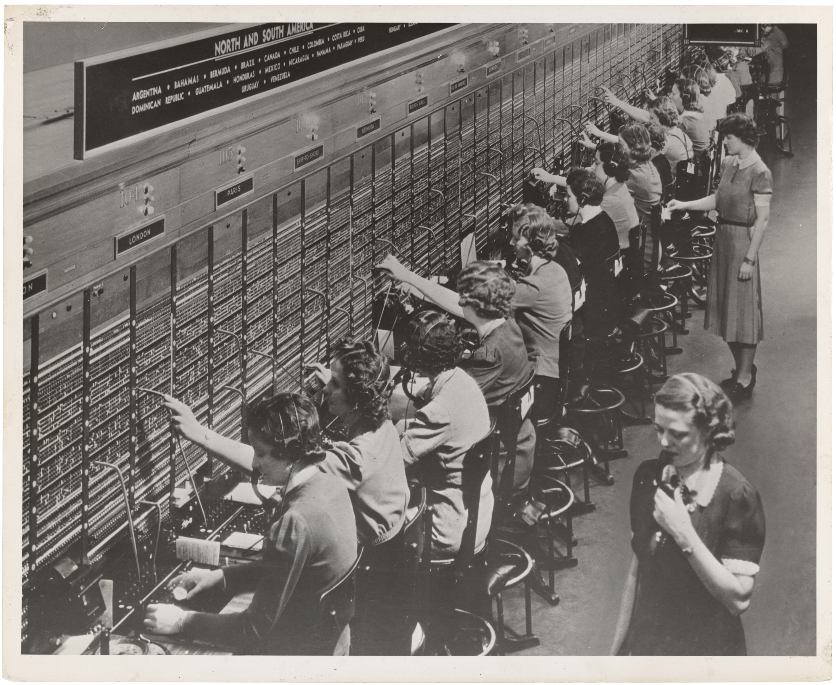 Women working a Bell System long-distance telephone switchboard